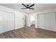 This bedroom boasts ample natural light, light hardwood flooring, and lots of closet space at 2142 E Palmcroft Dr, Tempe, AZ 85282