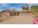 Inviting single-story home with a well-maintained concrete driveway and attached two-car garage at 2142 E Palmcroft Dr, Tempe, AZ 85282