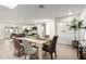 Open-concept living and dining area with ample natural light and neutral tones creates a welcoming atmosphere at 2142 E Palmcroft Dr, Tempe, AZ 85282
