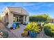 Serene backyard patio with lush landscaping, comfortable seating, and a covered area for relaxation at 22211 N 51St St, Phoenix, AZ 85054