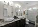 Bright bathroom boasts granite counters and new fixtures at 22211 N 51St St, Phoenix, AZ 85054