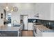 Bright kitchen featuring granite countertops, stainless steel appliances, and white cabinetry at 22211 N 51St St, Phoenix, AZ 85054