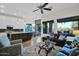 Spacious open-concept living area with large windows and seamless flow into the modern kitchen at 22211 N 51St St, Phoenix, AZ 85054