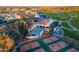 A pool and tennis courts are the central features in this aerial view of a vibrant community at 22288 S 214Th S St, Queen Creek, AZ 85142