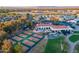 Aerial view of community amenities featuring tennis courts, a pool and a well-manicured golf course at 22288 S 214Th S St, Queen Creek, AZ 85142