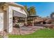 Covered patio offers a cozy outdoor space for relaxing and entertaining with desert landscaping at 22288 S 214Th S St, Queen Creek, AZ 85142