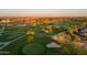 An aerial view showcases the lush greens and meticulously maintained fairways of a stunning golf course at 22288 S 214Th S St, Queen Creek, AZ 85142