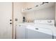 Laundry room featuring modern white washer and dryer units at 22288 S 214Th S St, Queen Creek, AZ 85142