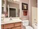 Bathroom showcasing wood cabinetry and a single sink vanity at 227 W Lantern Way, San Tan Valley, AZ 85143