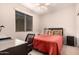 Bedroom with a window, carpet, and a built-in desk at 227 W Lantern Way, San Tan Valley, AZ 85143