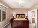 Bedroom with a ceiling fan, an ensuite bath, and neutral-toned walls at 227 W Lantern Way, San Tan Valley, AZ 85143