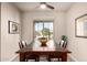 Dining room with dark wood table and chairs, natural light, and views to the front yard at 227 W Lantern Way, San Tan Valley, AZ 85143