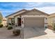 Charming single-Gathering home with a well-maintained lawn and two-car garage at 227 W Lantern Way, San Tan Valley, AZ 85143