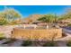 Beautiful community fountain with seating, desert landscaping, and mountain views at 227 W Lantern Way, San Tan Valley, AZ 85143