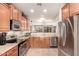 Well-equipped kitchen featuring stainless steel appliances, ample cabinet space, and open layout at 227 W Lantern Way, San Tan Valley, AZ 85143