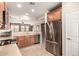 Modern kitchen with stainless steel appliances, bright countertops and an open view to the living area at 227 W Lantern Way, San Tan Valley, AZ 85143