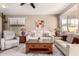 Bright living room with neutral tones, comfortable seating, and a decorative rug at 227 W Lantern Way, San Tan Valley, AZ 85143