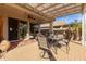 Charming outdoor patio featuring a dining area, built in barbecue and a cozy seating area by the home at 227 W Lantern Way, San Tan Valley, AZ 85143