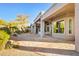 Beautiful backyard features a covered patio and desert landscaping with mature trees and plants at 22742 N 90Th St, Scottsdale, AZ 85255