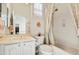 Bright bathroom featuring a shower/tub, toilet, and vanity with white cabinets at 22742 N 90Th St, Scottsdale, AZ 85255