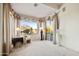 Bright bedroom sitting area with a comfortable chair, elegant decor, and a view of the backyard at 22742 N 90Th St, Scottsdale, AZ 85255