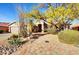 Inviting single-story home featuring desert landscaping and a charming brick pathway at 22742 N 90Th St, Scottsdale, AZ 85255