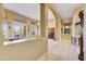 Hallway with tile flooring and archways leading to the living room at 22742 N 90Th St, Scottsdale, AZ 85255