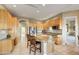 Well-lit kitchen featuring an island with seating and stainless steel appliances at 22742 N 90Th St, Scottsdale, AZ 85255