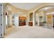 Large, neutral-toned living room showcasing elegant furniture, archways, and a tiled entryway at 22742 N 90Th St, Scottsdale, AZ 85255