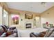 Inviting living room features a cozy fireplace, and bright windows, creating a warm atmosphere at 22742 N 90Th St, Scottsdale, AZ 85255