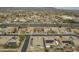 Overhead view capturing the well-planned community near desert landscape, a busy road and distant mountains at 22949 W Yavapai St, Buckeye, AZ 85326