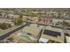 Overhead view of a house with a private pool and spa, showcasing the backyard layout and neighborhood streets at 22949 W Yavapai St, Buckeye, AZ 85326