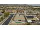 Aerial view of the residential community, showcasing neighborhood layout, roads, and a pool behind a home at 22949 W Yavapai St, Buckeye, AZ 85326