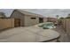 Backyard view of the house with a pool and spa at 22949 W Yavapai St, Buckeye, AZ 85326