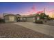 Beautiful home with a three-car garage, desert landscaping, and a modern design at 22949 W Yavapai St, Buckeye, AZ 85326