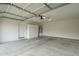 Spacious garage with high ceilings, storage cabinets, and a water heater at 22949 W Yavapai St, Buckeye, AZ 85326