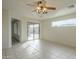 Inviting living room with a view to the backyard through sliding glass doors and ample natural light at 22949 W Yavapai St, Buckeye, AZ 85326