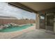 Covered patio overlooking a pool and landscaped backyard at 22949 W Yavapai St, Buckeye, AZ 85326