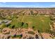 Aerial view of a park surrounded by a well-planned community, featuring green spaces and homes at 23004 E Desert Spoon Dr, Queen Creek, AZ 85142