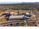 Aerial view of the school near the residential neighborhood, showcasing the campus and parking at 23004 E Desert Spoon Dr, Queen Creek, AZ 85142