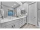 Bright bathroom featuring double sinks, large mirror and neutral paint at 23004 E Desert Spoon Dr, Queen Creek, AZ 85142