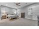 Bright bedroom featuring neutral paint, carpeted floors, ceiling fan, shutters and recessed lighting at 23004 E Desert Spoon Dr, Queen Creek, AZ 85142