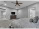 Spacious bedroom featuring neutral paint, carpeted floors and ensuite bathroom at 23004 E Desert Spoon Dr, Queen Creek, AZ 85142