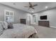 Bright bedroom featuring neutral paint, carpeted floors, ceiling fan and lots of natural light at 23004 E Desert Spoon Dr, Queen Creek, AZ 85142