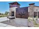 The Meadows community center signage with outdoor seating and building at 23072 N 98Th N Dr, Peoria, AZ 85383