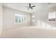 Bright and airy bedroom with carpet, ceiling fan, and plantation shutters at 23072 N 98Th N Dr, Peoria, AZ 85383