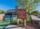 The Meadows pickle ball court with signage and a view of community amenities at 23072 N 98Th N Dr, Peoria, AZ 85383