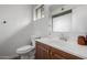 Simple bathroom design featuring updated sink, wood vanity and toilet at 2671 W Bentrup St, Chandler, AZ 85224