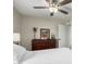 Cozy bedroom featuring a dresser with decor and a ceiling fan at 2671 W Bentrup St, Chandler, AZ 85224