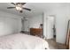 Relaxing bedroom with ceiling fan, dresser, carpet, and easy access to bathroom at 2671 W Bentrup St, Chandler, AZ 85224